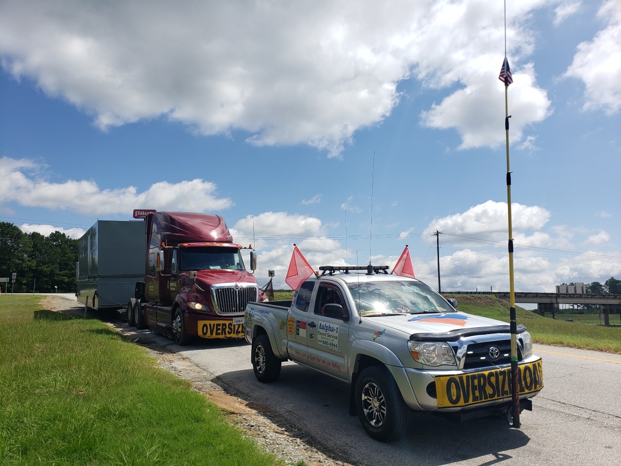pilot car leading heavy load transport